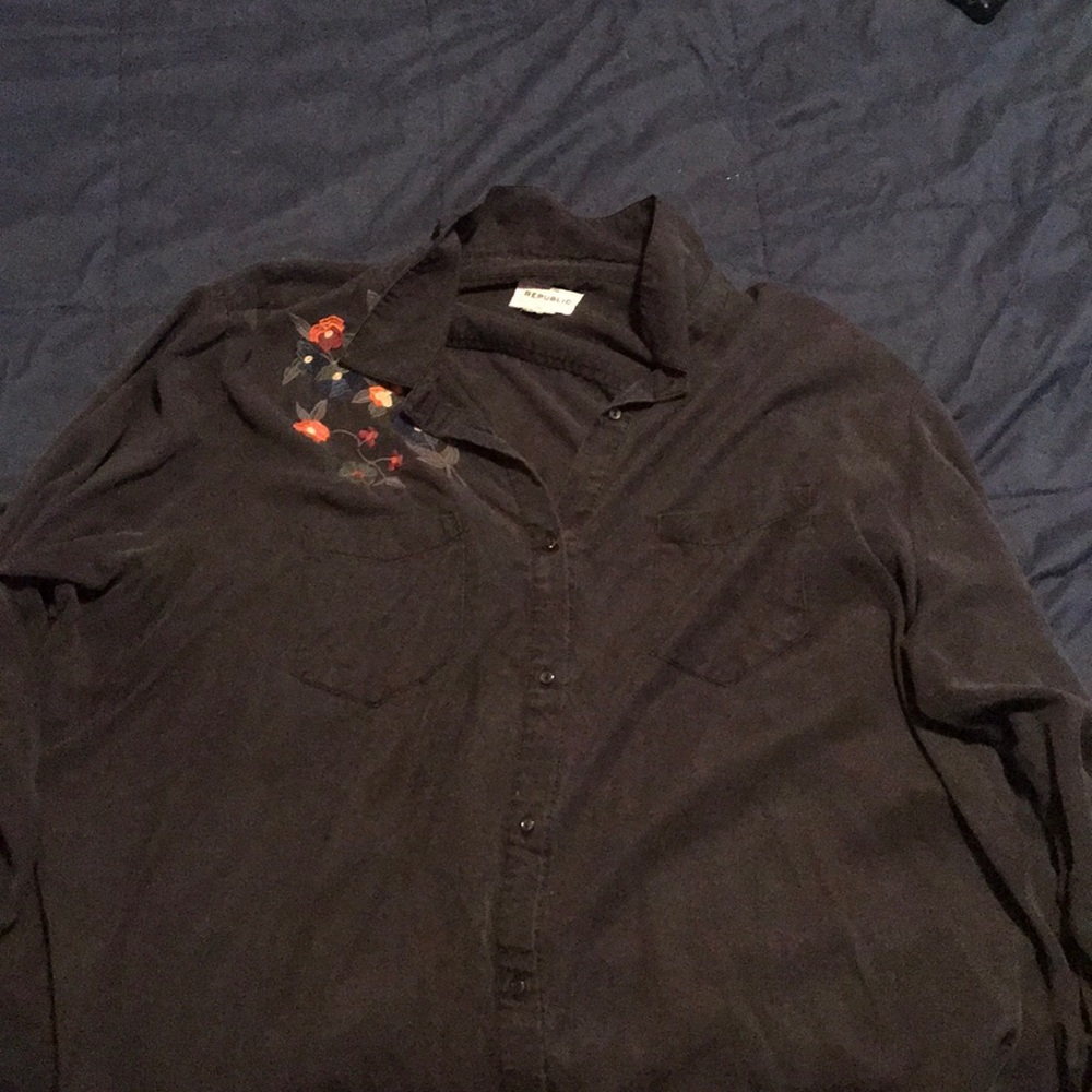 Black long sleeve button up shirt.